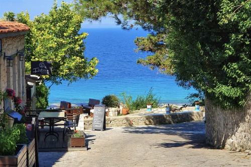 a view of the ocean from a path near a beach at Afitos Guest House in Afitos