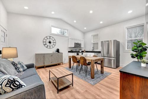 a living room with a couch and a table at Decca's Guesthouse in Siloam Springs
