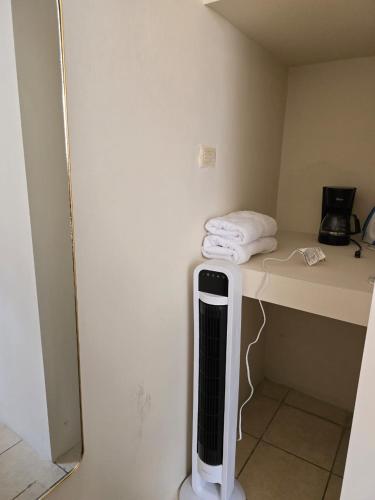 a room with a desk with a heater on it at Habitación Privada No 2 Residencial Villa de las Hadas Zona Sur in Tegucigalpa