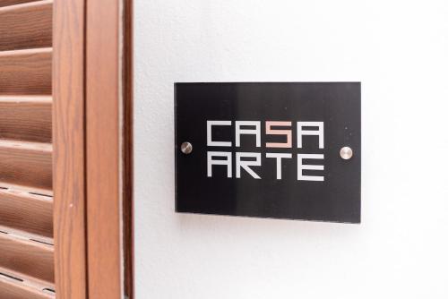 a sign on a door that reads cash rite at Casa Arte 5 in Aljezur