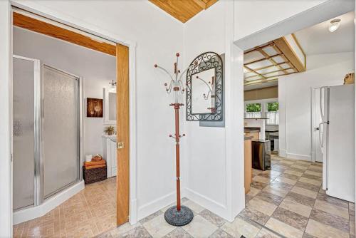 a room with a walk in shower and a mirror at Beit Shalom- House of Peace Family in Siloam Springs