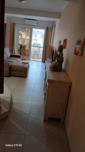 a living room with a monkey statue on a counter at Beach Villa am Praia de Chaves, Boa Vista, Cabo Verde in Boa Ventura