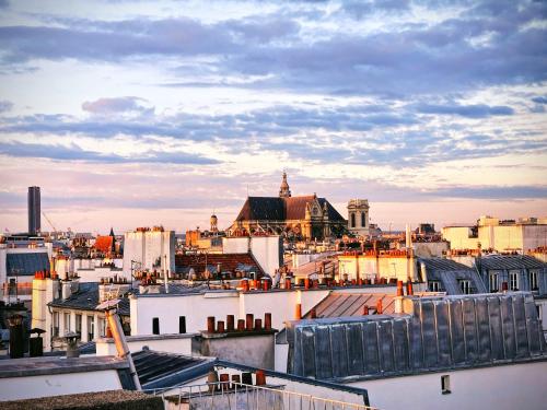 Studio duplex plein sud refait à neuf - paris 2ème - vue exceptionnelle toits