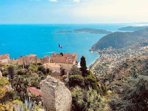 a castle on top of a hill overlooking the ocean at Beautiful sea view near Monaco in Roquebrune-Cap-Martin