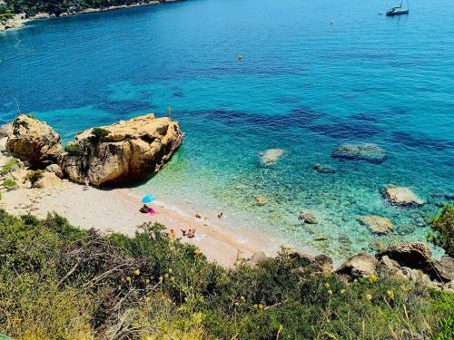 a group of people on a beach in the water at Beautiful sea view near Monaco in Roquebrune-Cap-Martin