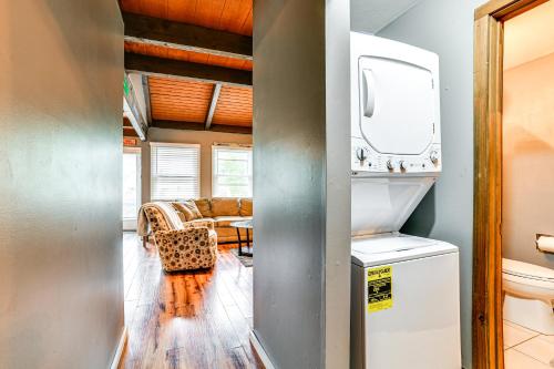 a kitchen and living room with a washer and dryer at Cortland Townhome - Walk to Greek Peak Mtn Resort! in Cortland