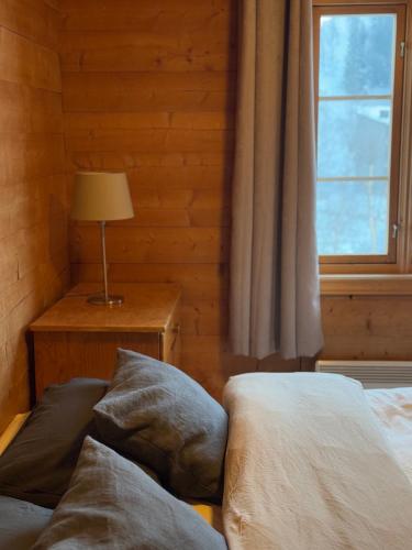 a bedroom with two beds and a window at Sirdal Fjellhytte - Holiday home at Sinnes in Haugen
