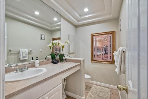 a bathroom with a sink and a toilet at La Costa Condo Pool BBQ Gated Parking in Carlsbad