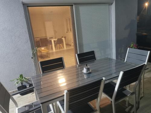 a large wooden table with chairs and a dining room at Vila V & S in Star Dojran