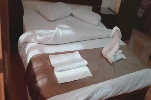 Postel nebo postele na pokoji v ubytování Al-Nujoom Hotel Suites