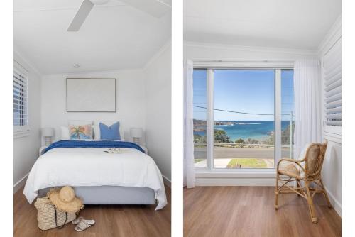 une chambre avec un lit et une fenêtre dans l'établissement Waves at Boat Harbour, 65 Kingsley Dr - stunning house, fantastic waterviews and dog friendly, à Boat Harbour