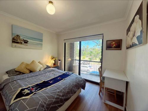 Ένα ή περισσότερα κρεβάτια σε δωμάτιο στο Himeji Garden 2 Bedrooms Apartment Free Wi-Fi