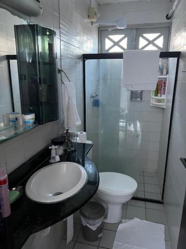 a bathroom with a sink and a toilet at Lar do Mar proximo veneza water park in Paulista
