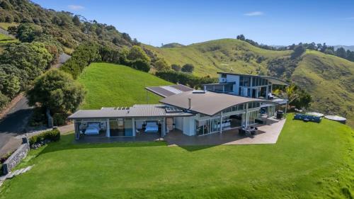 an aerial view of a house on a hill at Luxury Hilltop Villa with Breathtaking Views- Perfect for Family Stays & Events in Waiwera
