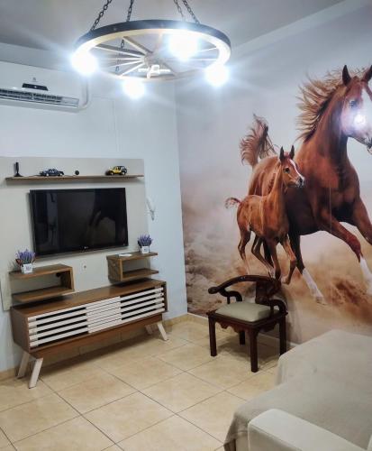 Televisyen dan/atau pusat hiburan di Apartamento lindo, amplo e confortável