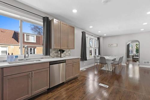 a kitchen and dining room with a table and chairs at Morton Grove w Game Room & Huge Yard in Morton Grove