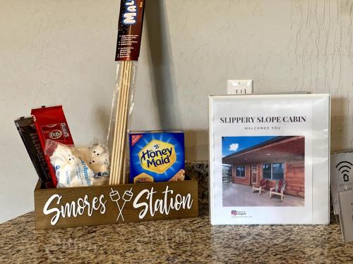 a counter top with snacks and a book and a guitar at Slippery Slope Cabin at Deep Creek Lake / Wisp Mountain (3 BR) in McHenry
