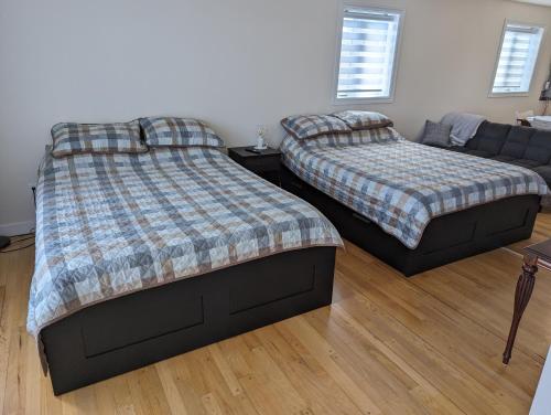 Postel nebo postele na pokoji v ubytování Les Appartements de Belle-Maman