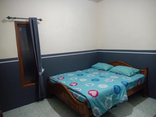 Postel nebo postele na pokoji v ubytování Holiday Home Anggun Bromo