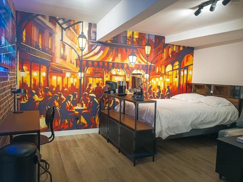 - une chambre ornée d'une peinture murale dans l'établissement Studio de Charme Quartier Carmes, à Toulouse