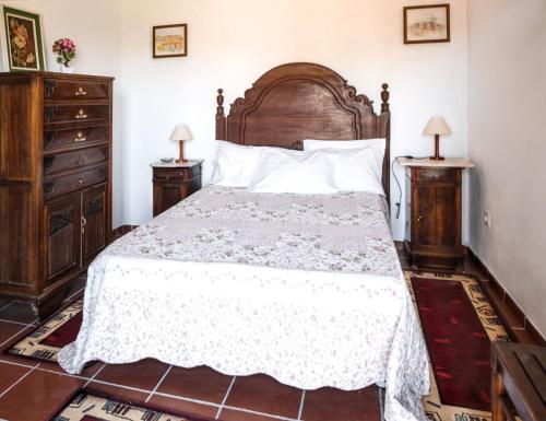 a bedroom with a large bed and two night stands at Charming House in Fornos with shared pool in Fornos