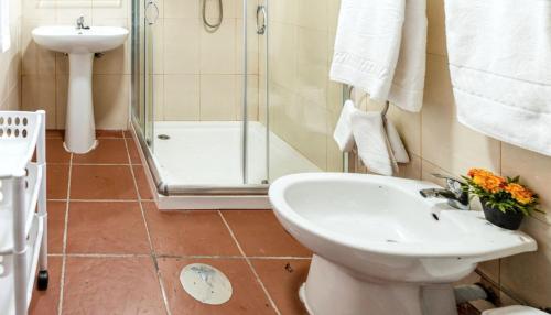 a bathroom with a shower and a toilet and a sink at Charming House in Fornos with shared pool in Fornos