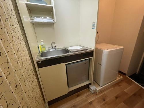 Η κουζίνα ή μικρή κουζίνα στο A&C STAY Shin-Osaka