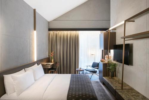 Postel nebo postele na pokoji v ubytování The Warehouse Hotel, Singapore, a Member of Design Hotels