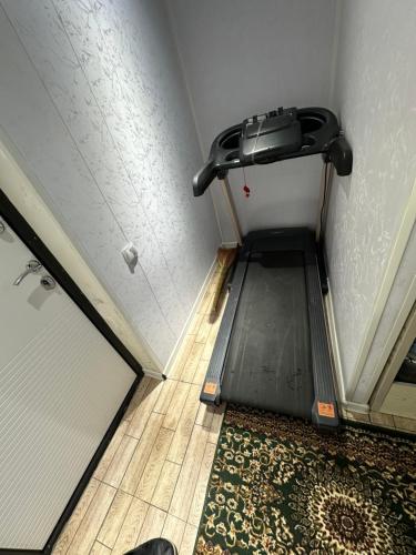 a room with a hallway with a door and a rug at Chilanzar Apartment for 5 persons 5 beds, kitchen, Bathroom, toilet, Wifi, TV, washing machine in Chilanzar