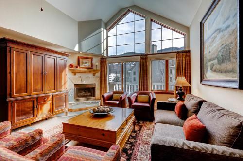 a living room with a couch and a table at St. James Place in Beaver Creek