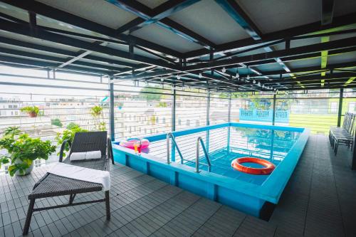 a balcony with a swimming pool in a building at Crystal Holiday Hotel Ha long - 3 Loc Vung Street in Ha Long