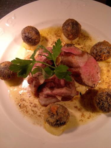 a plate of food with meat and meat balls at The Lamplighter Dining ~ Rooms in Windermere