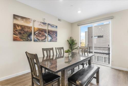 a dining room with a table and chairs and a window at Here Comes the Sun condo in Atkinville