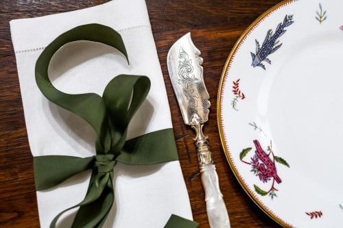 a table with a plate and a fork and knife at Thorngrove Manor in Stirling
