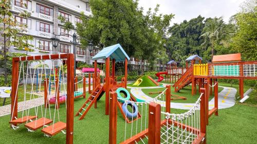 a playground with many different types of play equipment at Lorin Dwangsa Solo Hotel in Solo