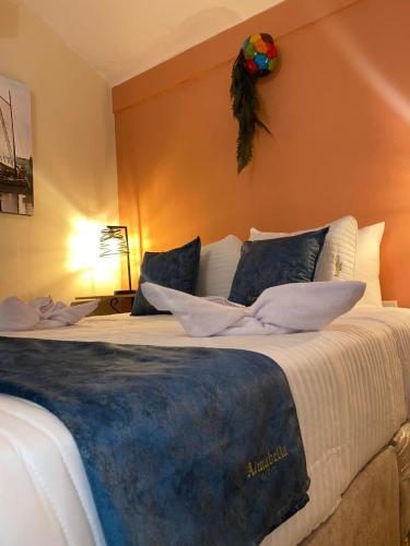 Postel nebo postele na pokoji v ubytování Almabella Hotel