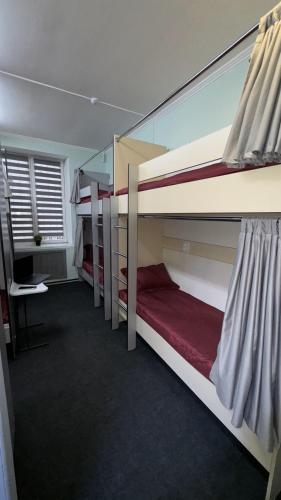 a group of bunk beds in a room at Лучший хостел Алматы - Масанчи in Almaty