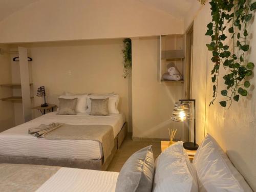 Postel nebo postele na pokoji v ubytování Almabella Hotel