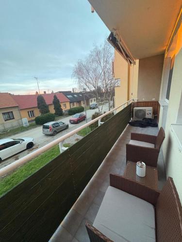 a balcony with benches and a view of a street at Apartmány Skalica in Skalica