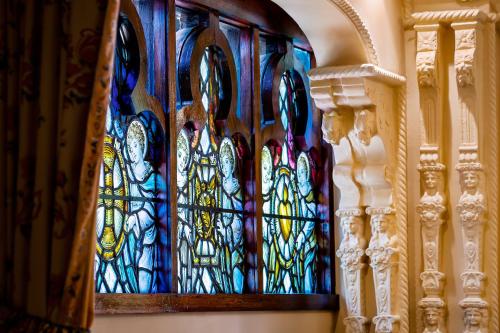 a stained glass window on the wall of a building at Thorngrove Manor in Stirling