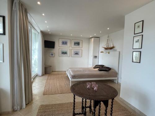 a bedroom with a bed and a table at Strandgut in Rostock