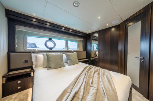 a bedroom with a large bed in a boat at Luxusyacht Mallorca in Portals Nous