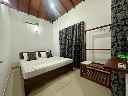 Postel nebo postele na pokoji v ubytování Aroma Villa Homestay