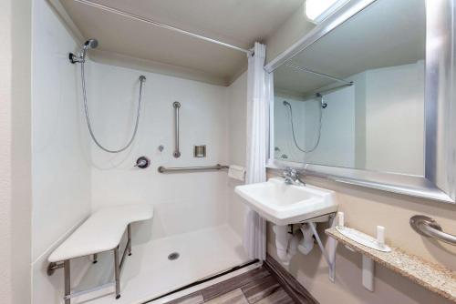 a bathroom with a sink and a shower at Comfort Inn Lathrop Stockton Airport in Lathrop