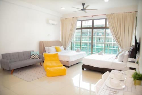 a living room with two beds and a couch at -Mount Austin IKEA, AEON 10mins -Pool View- B215 in Johor Bahru
