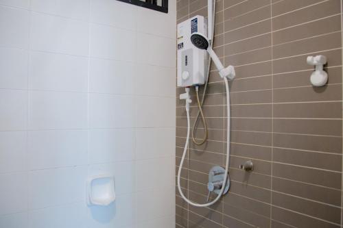 a shower with a blow dryer in a bathroom at -Mount Austin IKEA, AEON 10mins -Pool View- B215 in Johor Bahru