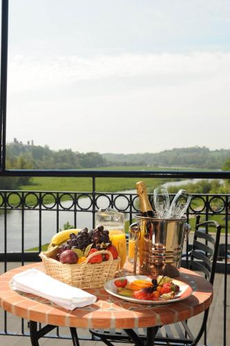 a table with a basket of fruit and a basket of juice at The Riverside Park Hotel in Enniscorthy