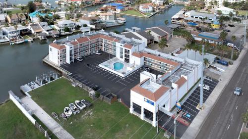 an aerial view of a house next to a marina at WindWater Hotel and Marina in South Padre Island