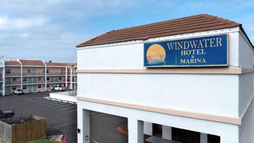 a sign on the side of a building with a parking lot at WindWater Hotel and Marina in South Padre Island