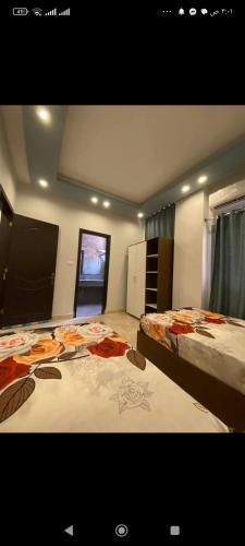 a bedroom with two beds and a window at Happy house Aswan in Aswan